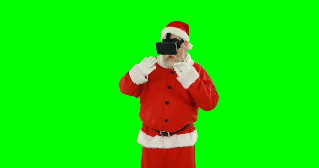 Santa Claus Using Virtual Reality Headset Isolated on Green Background - Free Images, Stock Photos and Pictures on Pikwizard.com