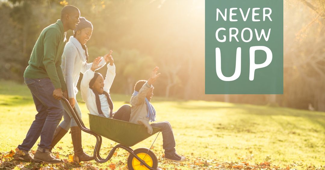 Joyful Family Enjoying Playful Wheelbarrow Ride in Park