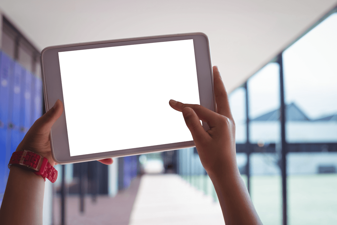 Student Holding Digital Tablet in School Corridor with Transparent Screen