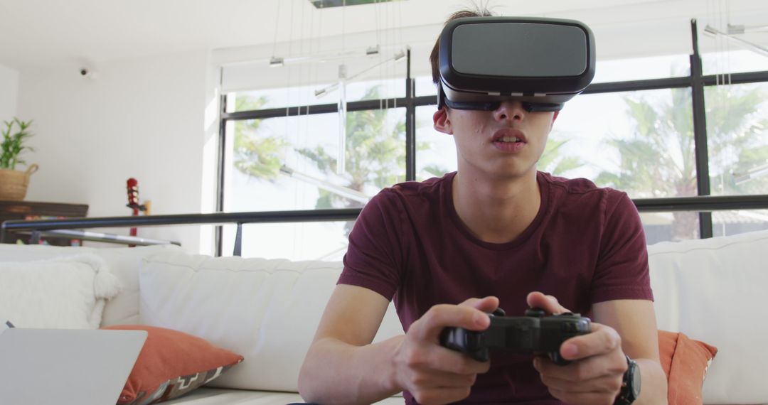 Teenager Immersed in Virtual Reality Gaming at Home - Free Images, Stock Photos and Pictures on Pikwizard.com