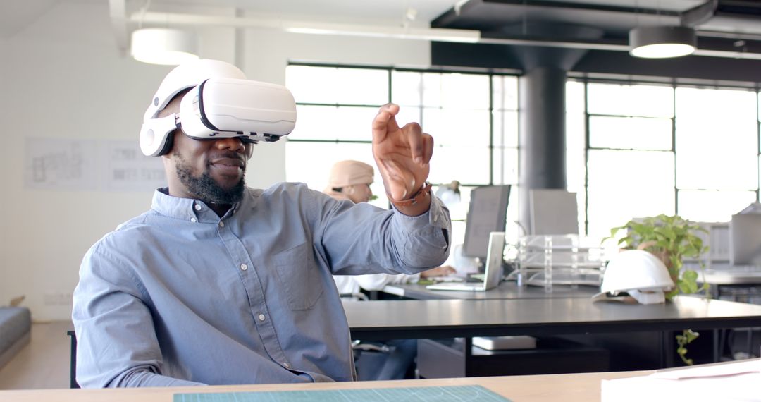 Man Engaging with VR Technology in Modern Office Environment