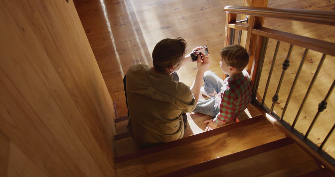 Father and Child Sitting on Wooden Staircase Bonding - Free Images, Stock Photos and Pictures on Pikwizard.com