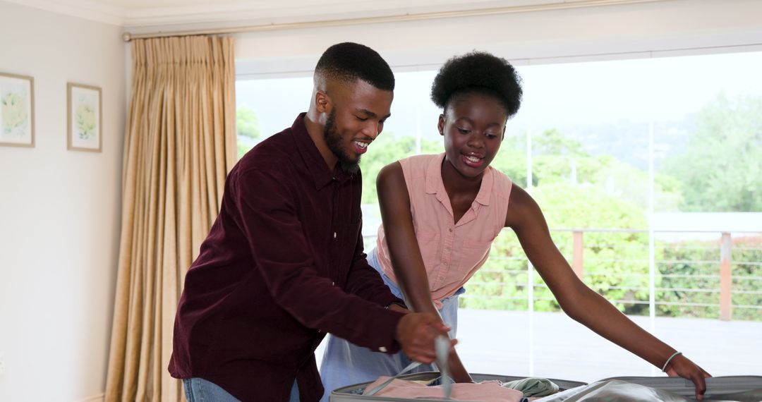 Happy Couple Packing Suitcase for Exciting Vacation