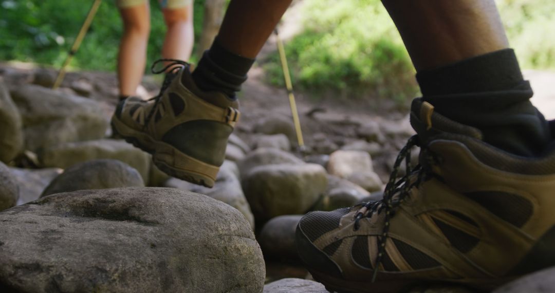 Close-Up of Hikers' Boots on Rocky Terrain in Forest - Free Images, Stock Photos and Pictures on Pikwizard.com