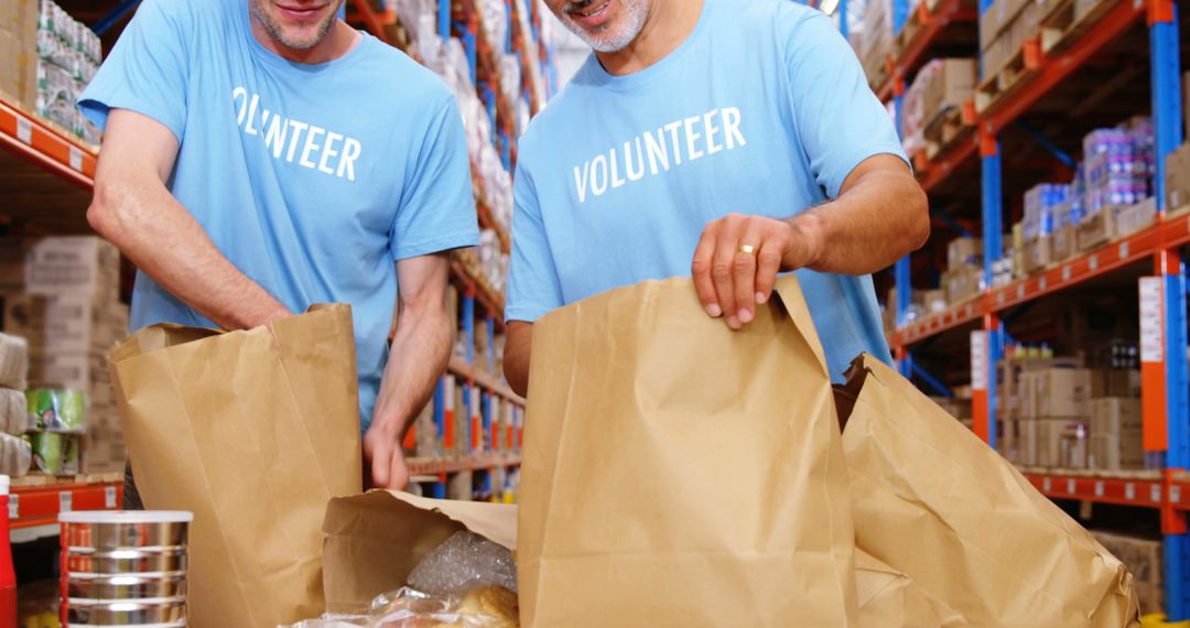 Volunteers Packing Groceries in Food Bank Warehouse - Free Images, Stock Photos and Pictures on Pikwizard.com