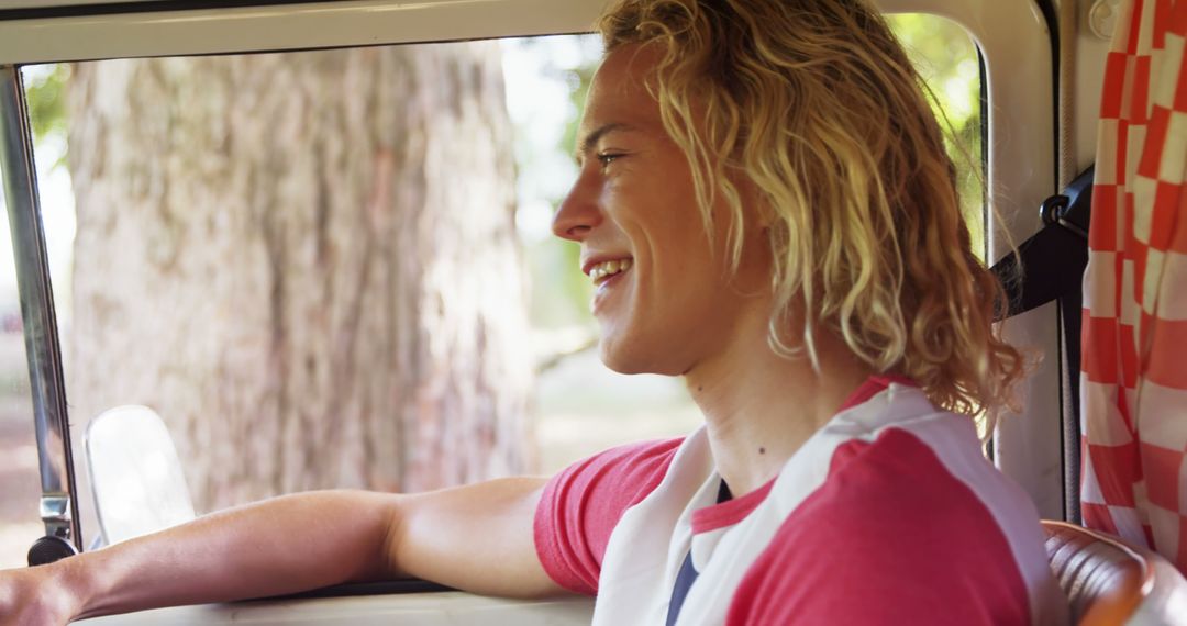 Happy Young Man Driving Camper Van on Road Trip - Free Images, Stock Photos and Pictures on Pikwizard.com