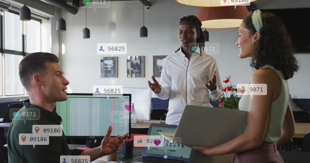Diverse Team Engaging in Digital Technology Discussion in Office
