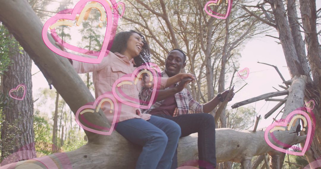 Joyful Couple Relaxing in Forest with Heart Overlays