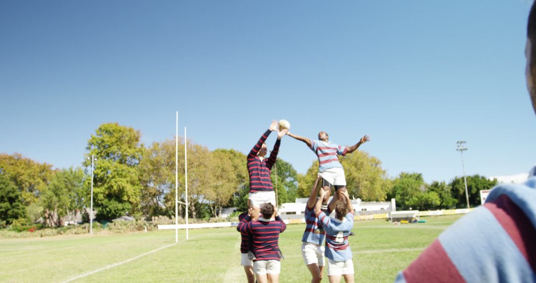 Rugby Players During Lineout On Field Under Clear Sky - Free Images, Stock Photos and Pictures on Pikwizard.com