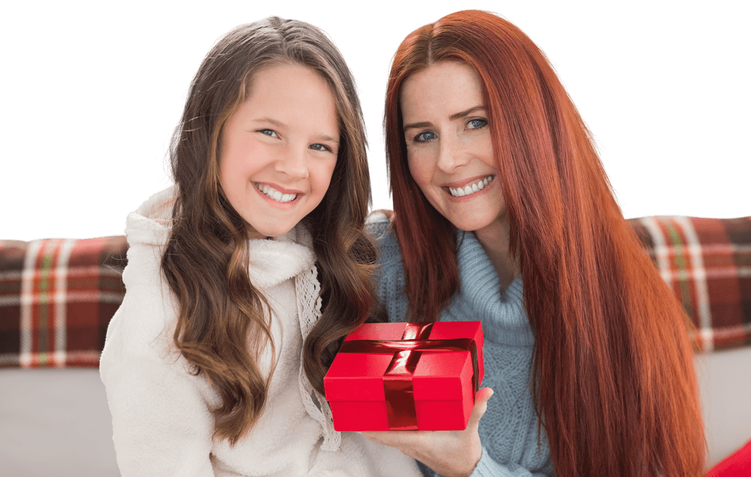 Caucasian Mother and Daughter Smiling with Wrapped Gift
