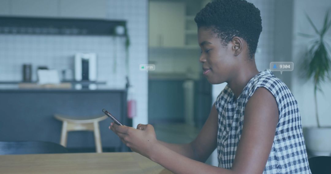 Woman Interacting with Smartphone in Minimalist Kitchen Setting
