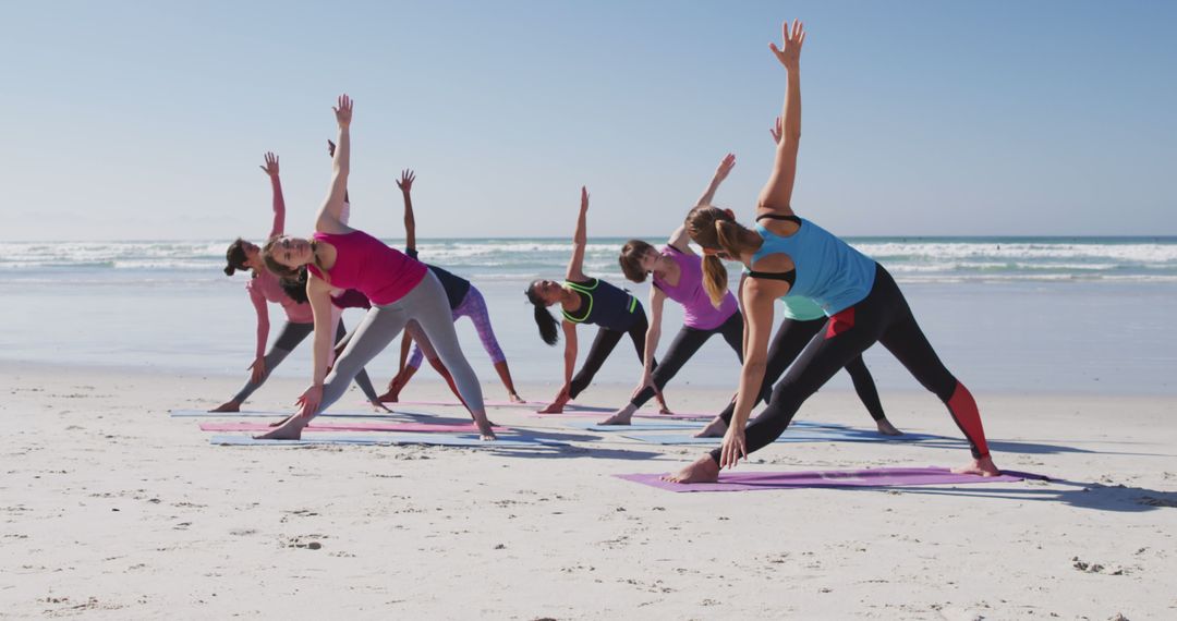 Group Yoga Fitness Class Practicing Stretching on Beach - Free Images, Stock Photos and Pictures on Pikwizard.com