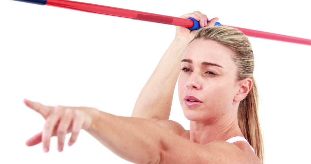 Athletic Woman Posing with Javelin on White Background
