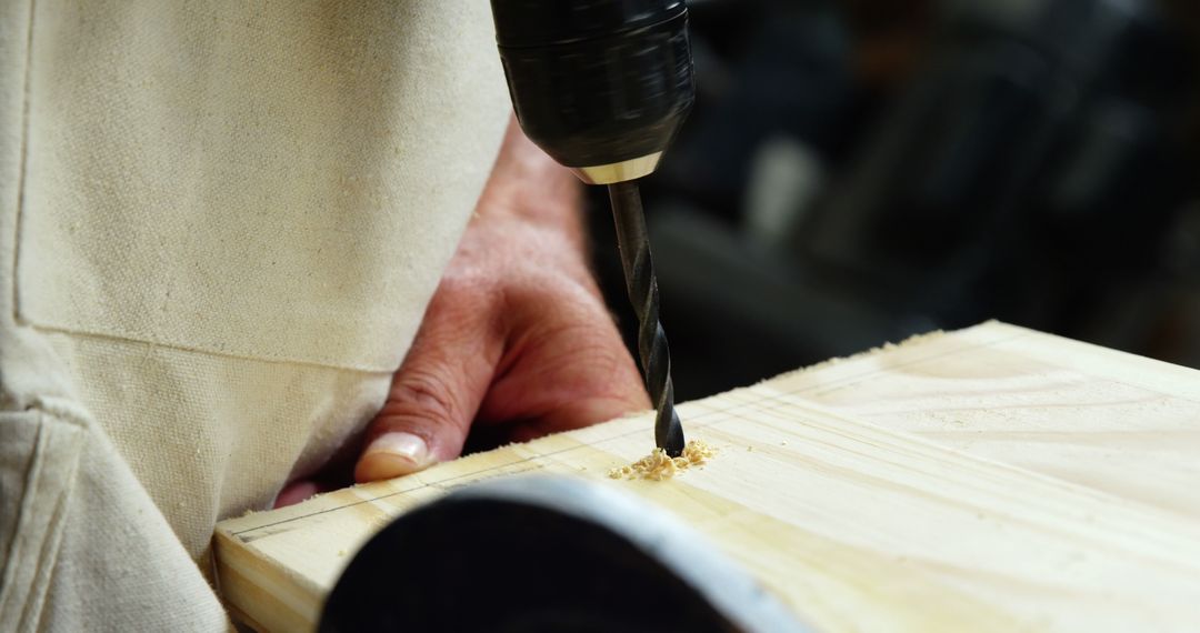 Close-Up of Carpenter Drilling Into Wood Board - Free Images, Stock Photos and Pictures on Pikwizard.com