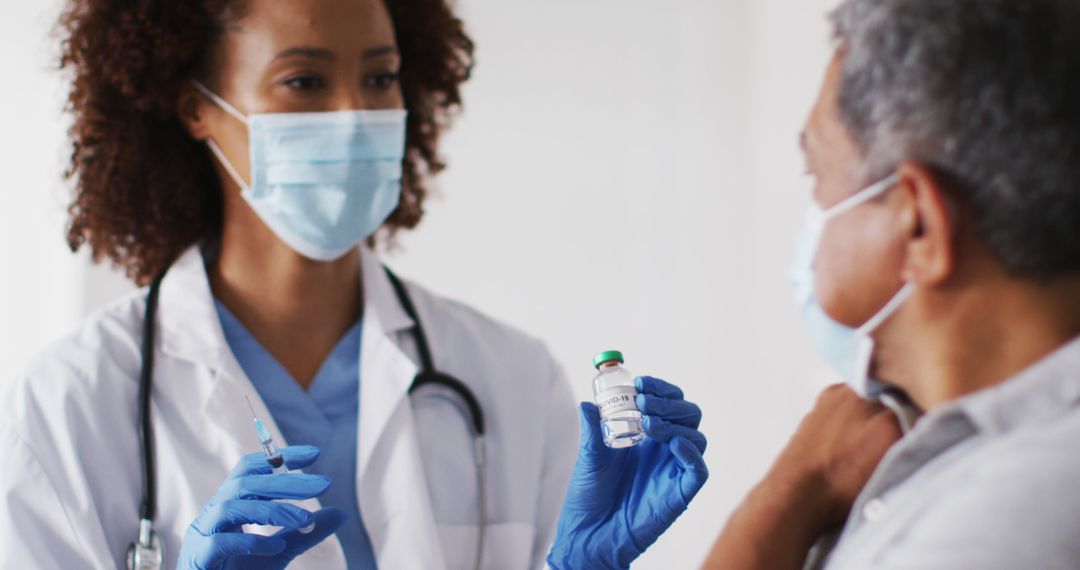 Female Doctor Discussing Vaccine with Elderly Patient in Medical Office - Free Images, Stock Photos and Pictures on Pikwizard.com