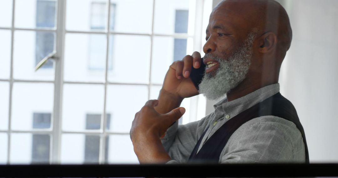 African American Businessman Negotiates Important Deal on Phone