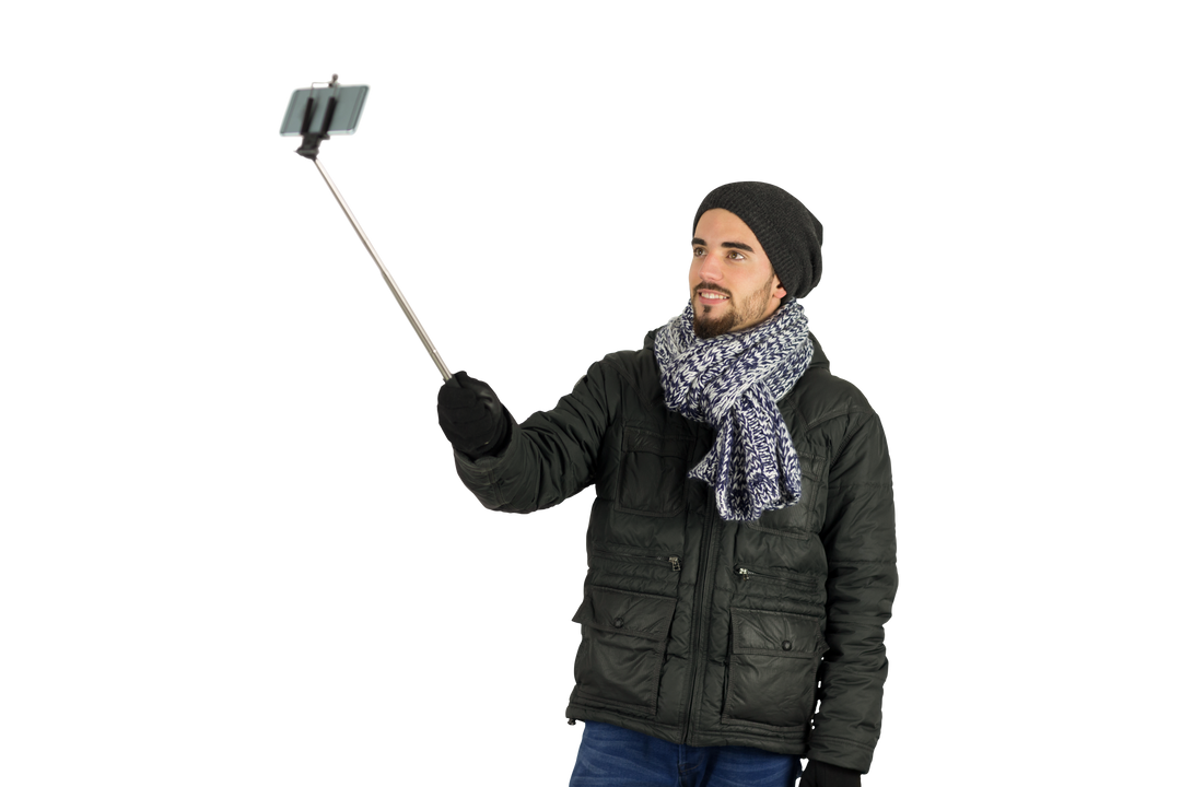 Man in Warm Clothing Taking Transparent Selfie with Selfie Stick - Download Free Stock Images Pikwizard.com