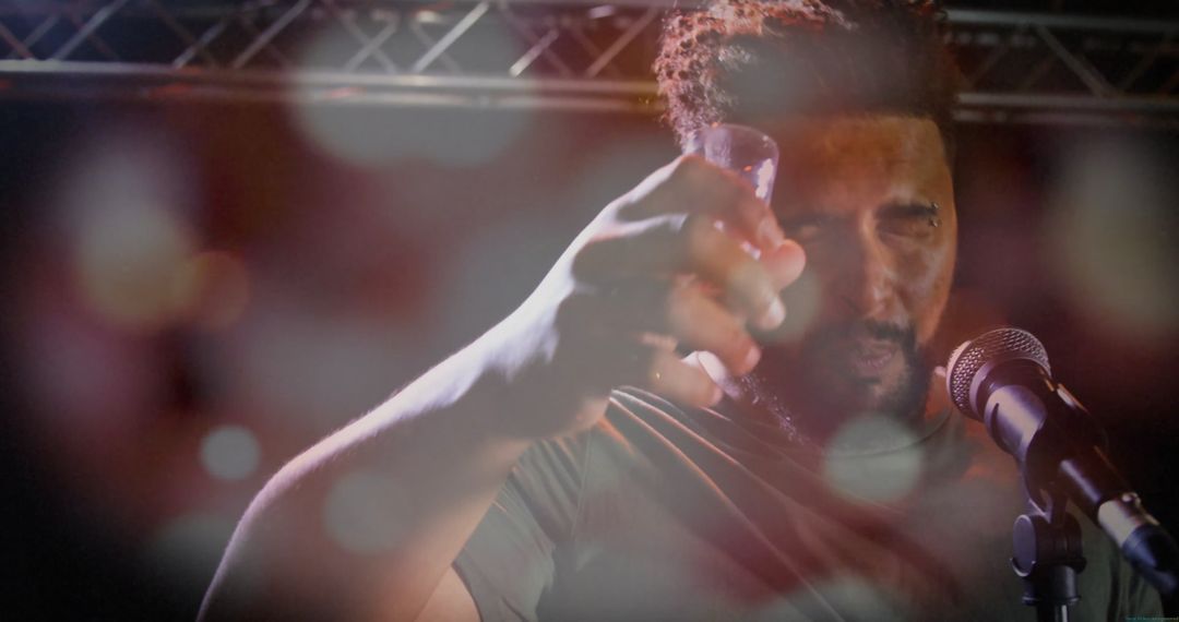 Energetic Music Performance with Toasting Gesture on Stage