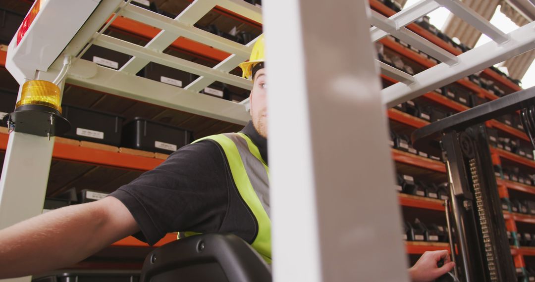 Warehouse Worker Operating Forklift in Storage Facility - Free Images, Stock Photos and Pictures on Pikwizard.com