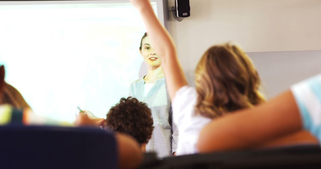 Female Teacher Leading Classroom Discussion with Engaged Students - Free Images, Stock Photos and Pictures on Pikwizard.com