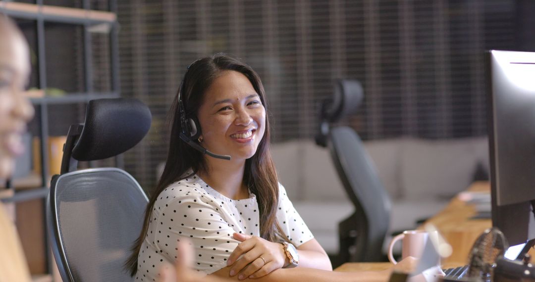 Smiling Customer Service Representative Wearing Headset at Workstation