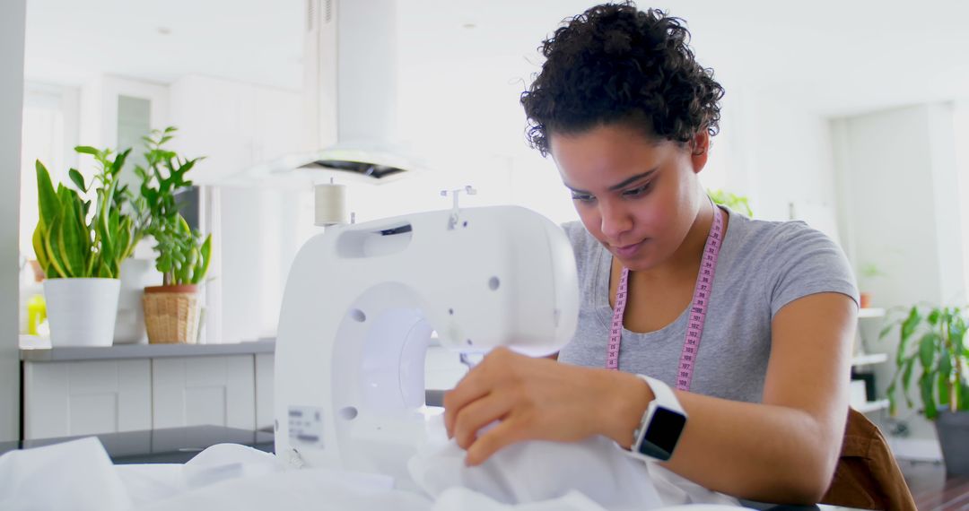 Young Woman Focused on Sewing at Home - Free Images, Stock Photos and Pictures on Pikwizard.com