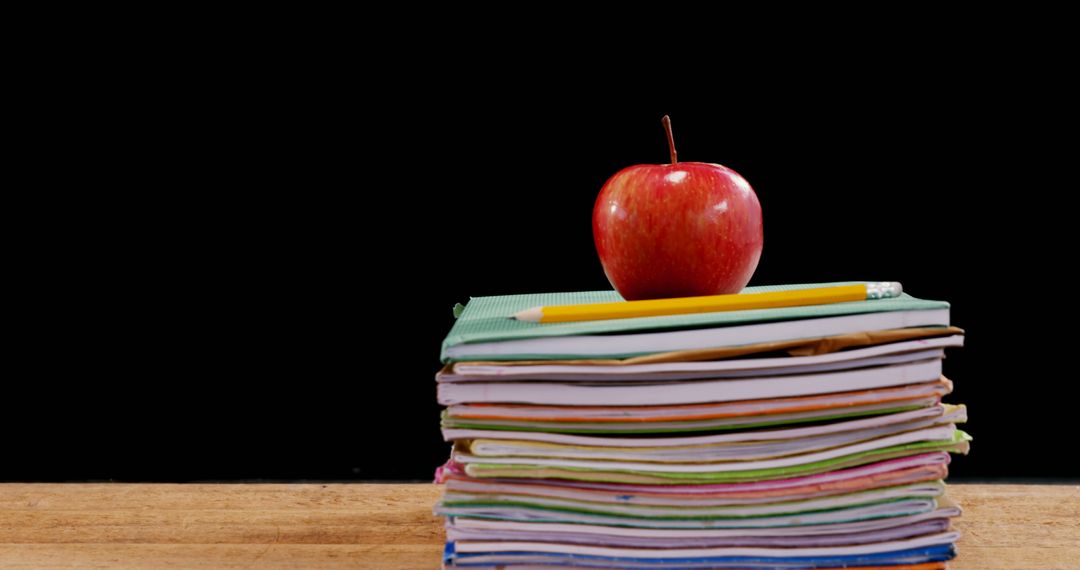Stack of School Books with Apple and Pencil for Education Concept