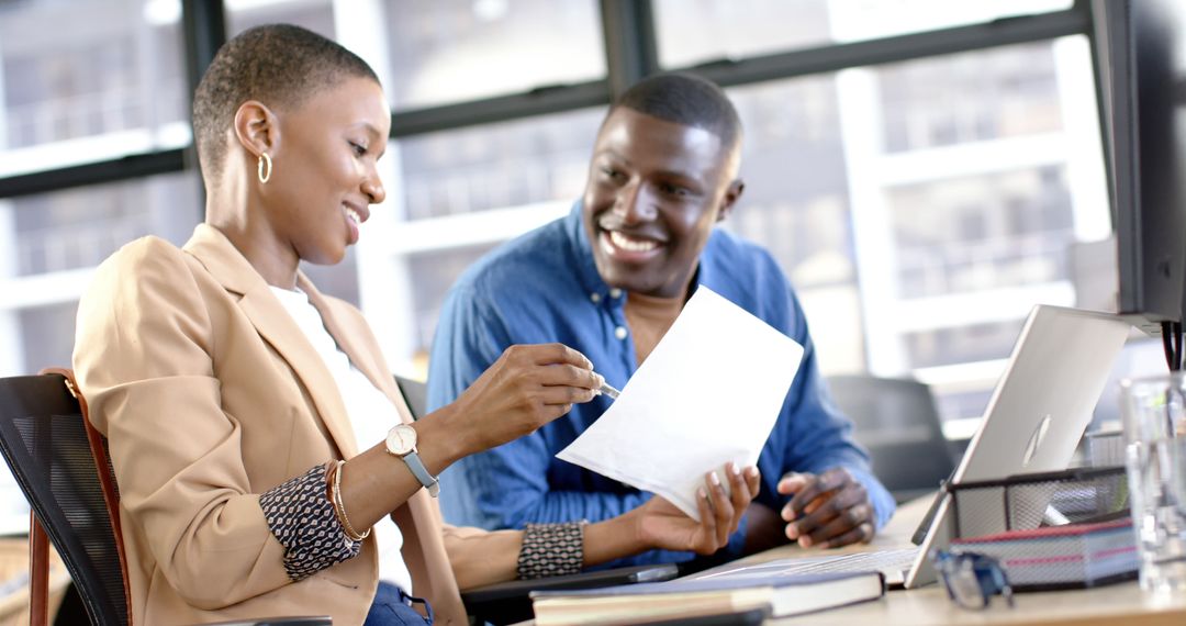 Professional Office Team Collaborating on Document