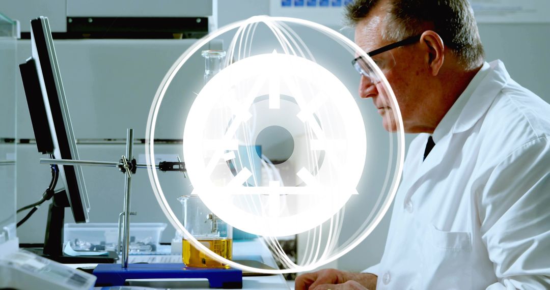 Senior Chemist Studying Analytical Data on Monitor While Conducting Laboratory Experiment