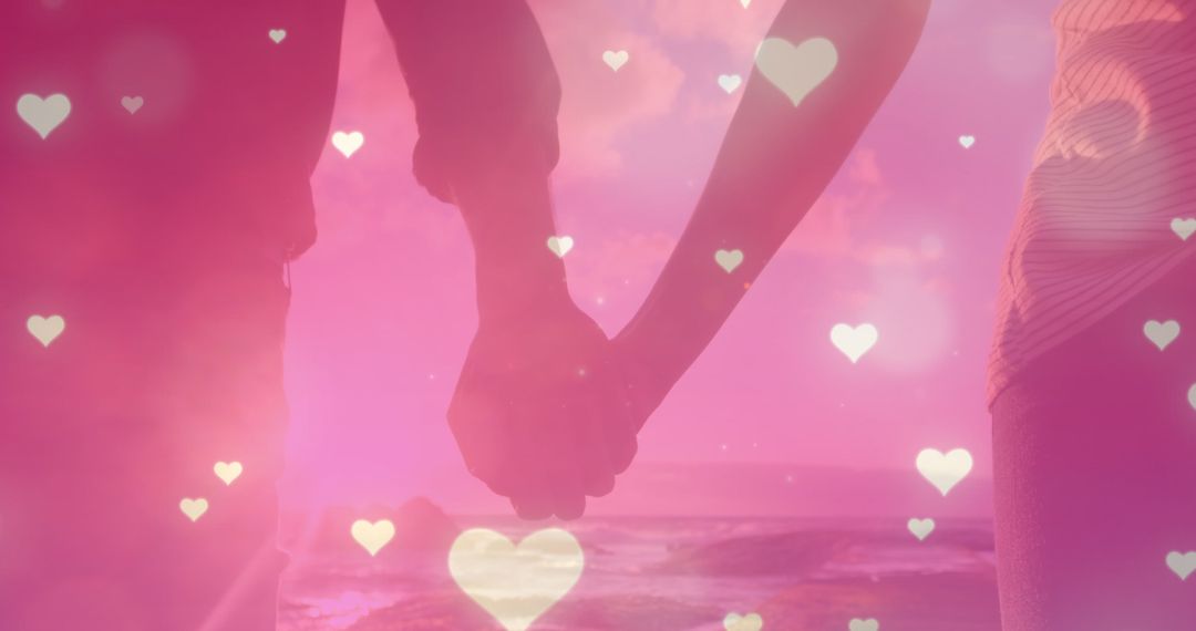 Romantic Couple Holding Hands with Heart Overlays at Sunset - Free Images, Stock Photos and Pictures on Pikwizard.com