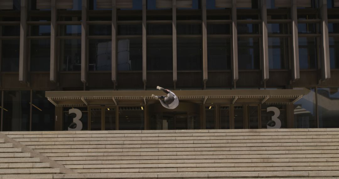 Urban Parkour Athlete Performing Backflip on Concrete Stairs - Free Images, Stock Photos and Pictures on Pikwizard.com