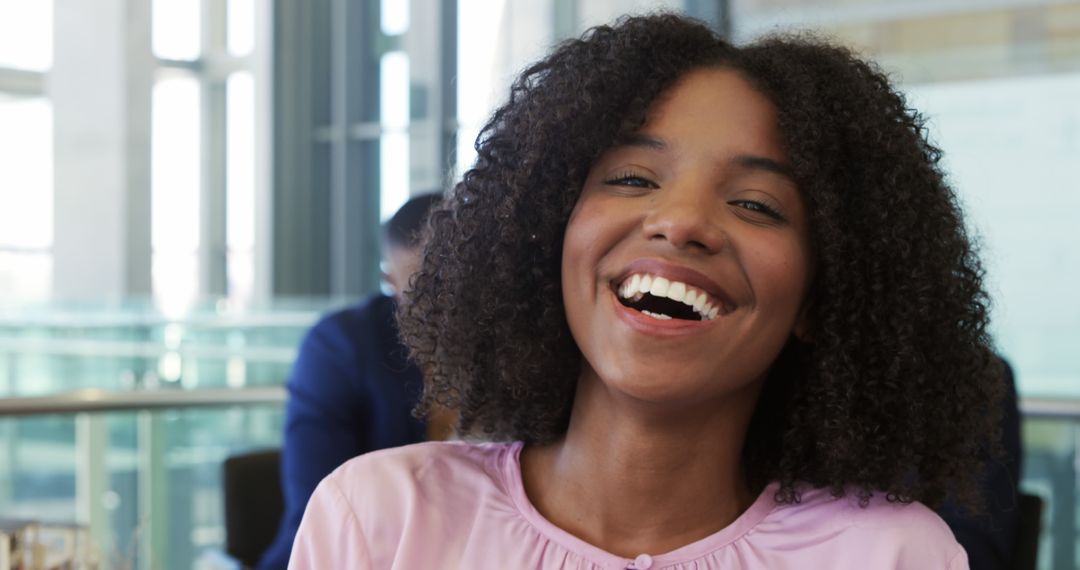 Smiling Young Businesswoman in Modern Office