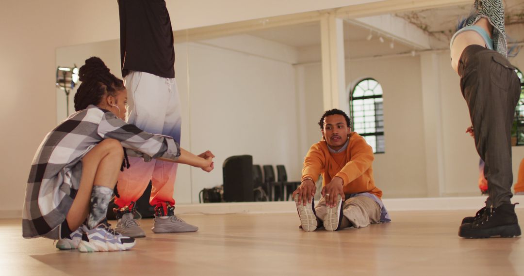 Diverse Dancers Stretching in Contemporary Dance Studio - Free Images, Stock Photos and Pictures on Pikwizard.com