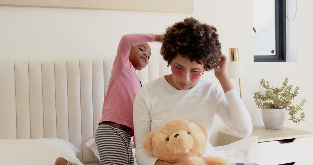 Mother and Daughter Bonding while Styling Hair and Playing with Toys