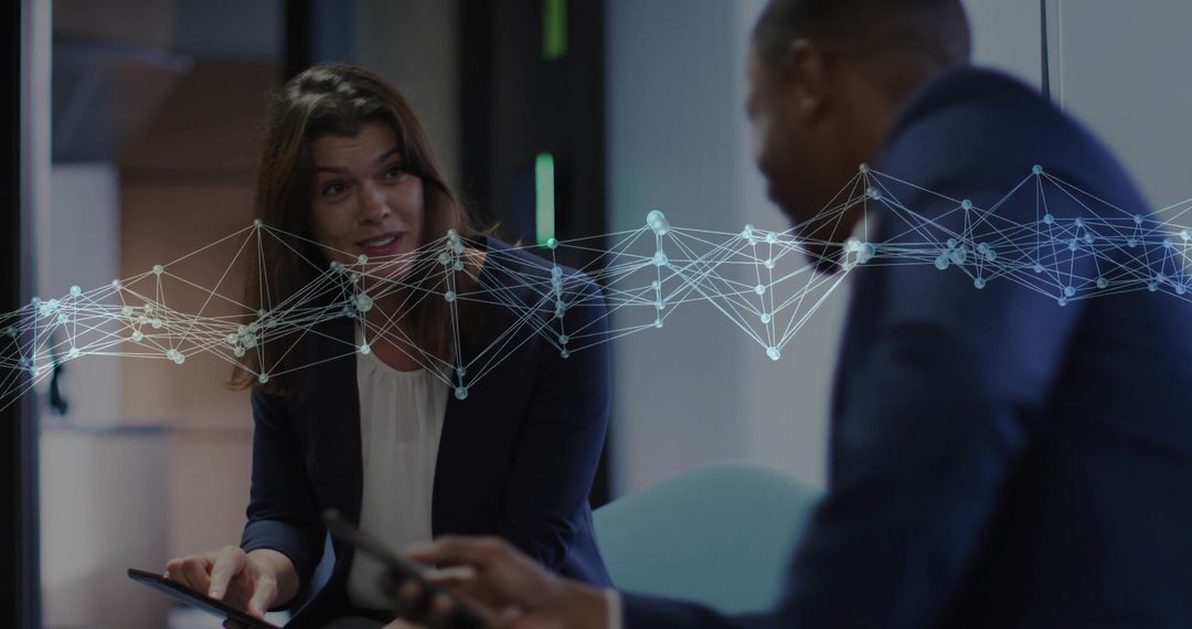 Professionals Collaborating with Digital Network Interface in Office