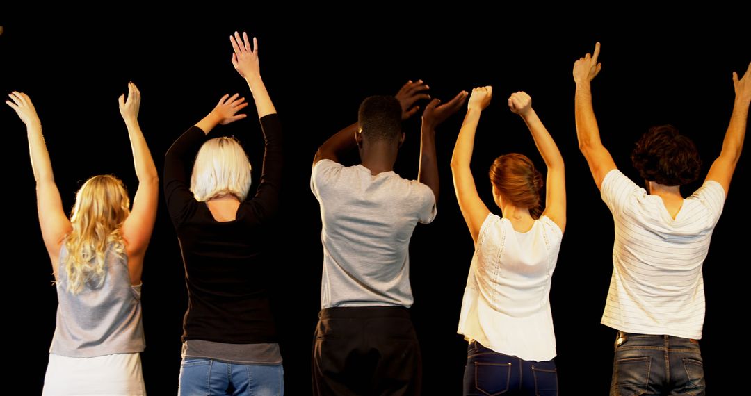 A diverse group raises hands against a black backdrop, possibly indicating engagement or voting. - Free Images, Stock Photos and Pictures on Pikwizard.com