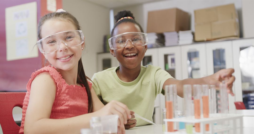 Portrait of happy diverse schoolgirls doing expeiments during science lesson at school - Free Images, Stock Photos and Pictures on Pikwizard.com