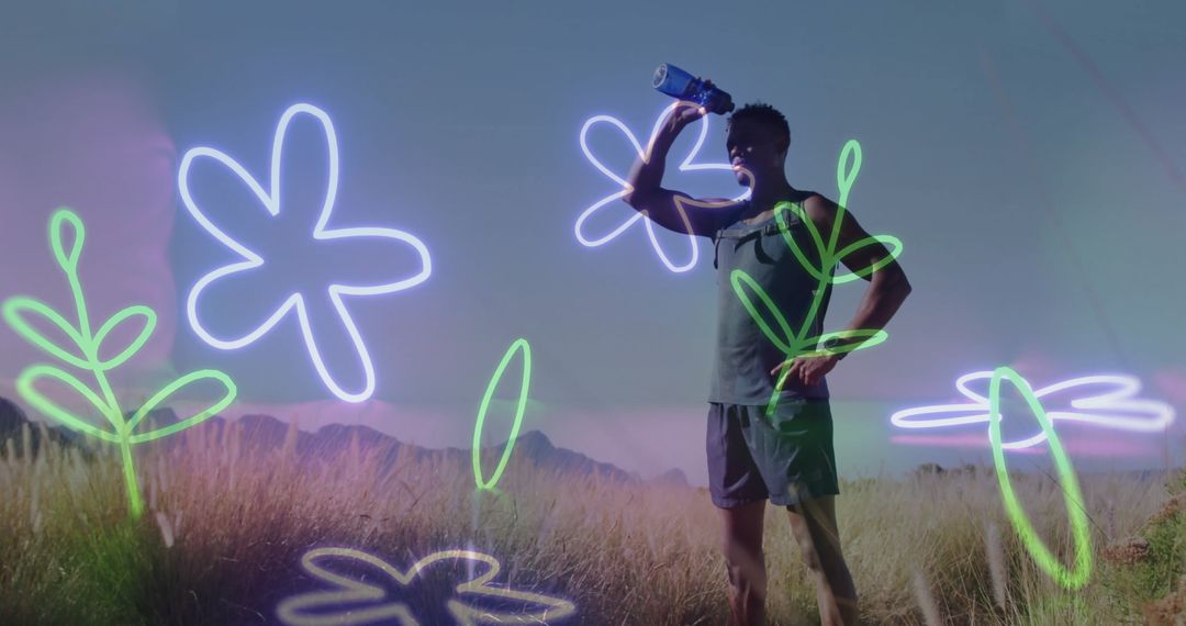 Runner Hydrating in Colorful Meadow Near Mountain