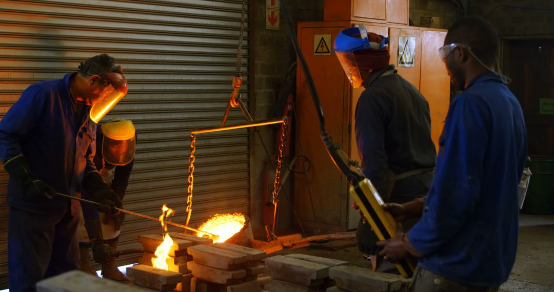 Foundry Workers Melting Metal with Heavy Machinery - Free Images, Stock Photos and Pictures on Pikwizard.com