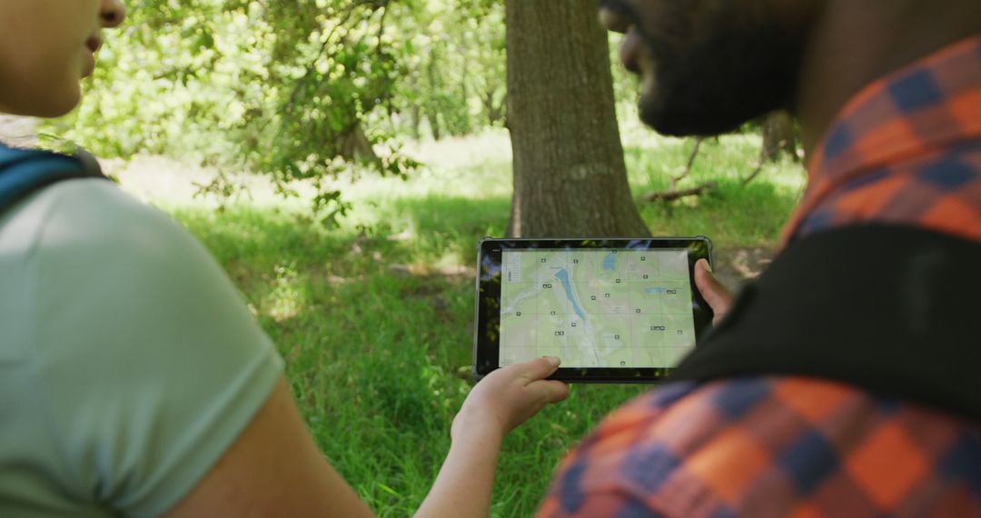 Two Hikers Navigating Forest Trail with Digital Tablet and GPS Map - Free Images, Stock Photos and Pictures on Pikwizard.com