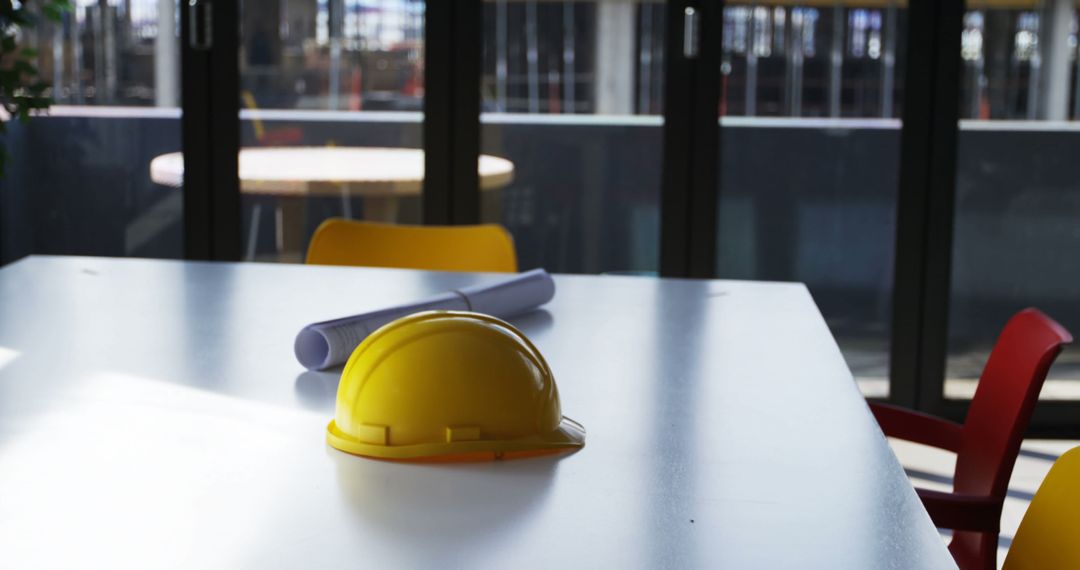 Yellow Construction Helmet on White Table in Modern Office - Free Images, Stock Photos and Pictures on Pikwizard.com