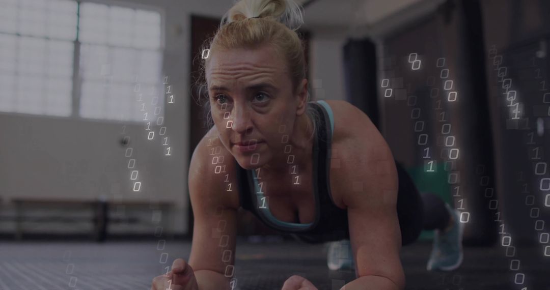 Focused Woman Holding Plank with Digital Binary Coding Overlay