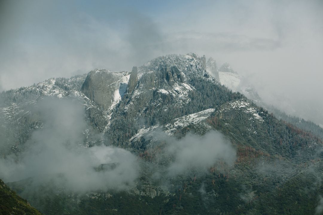 Misty Mountain Range with Snow-Covered Peaks - Free Images, Stock Photos and Pictures on Pikwizard.com