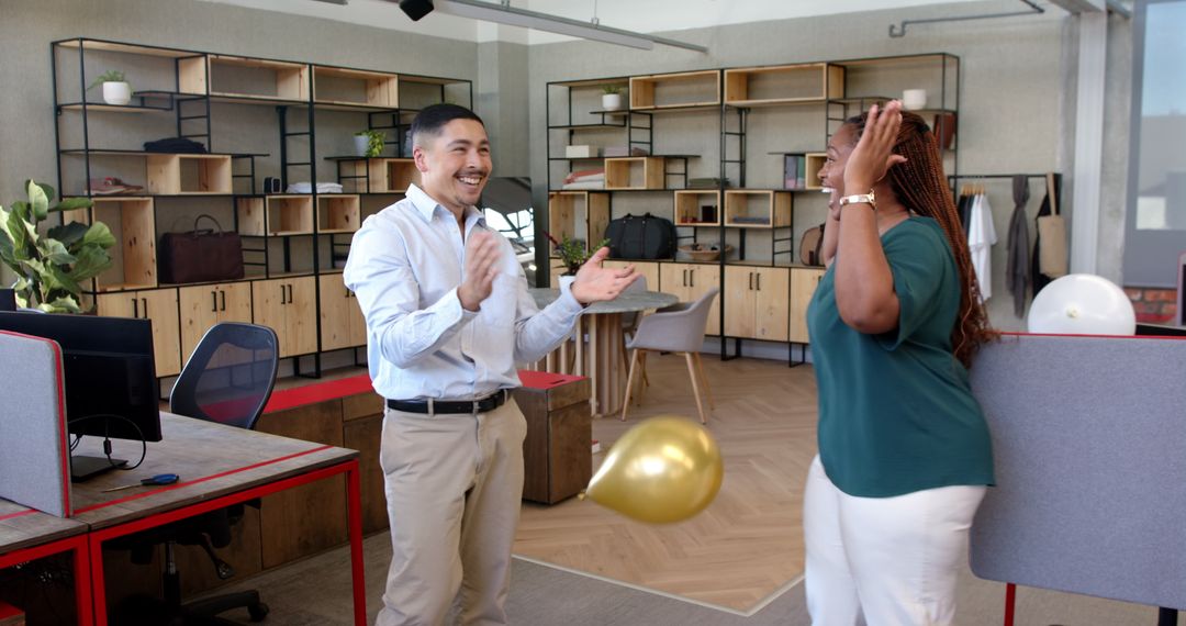 Colleagues Celebrating Successful Project in Modern Office