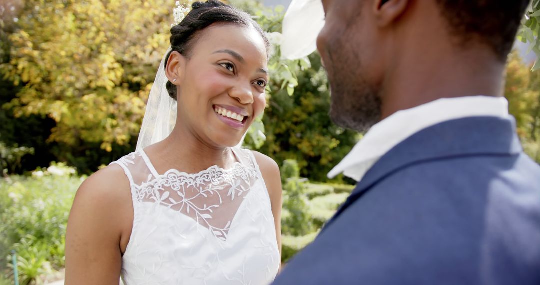 Happy Bride Smiling at Groom During Outdoor Wedding Ceremony - Free Images, Stock Photos and Pictures on Pikwizard.com