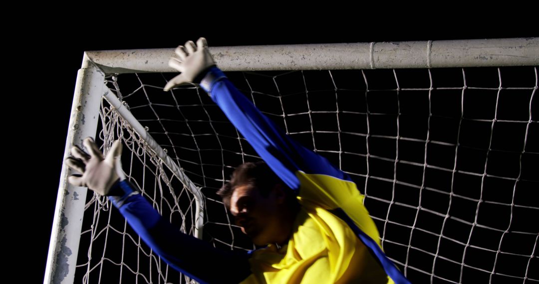 Soccer Goalkeeper Making Dramatic Save During Night Match - Free Images, Stock Photos and Pictures on Pikwizard.com