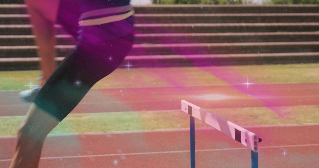 Female Athlete Hurdling Over Hurdle on Track with Pink Motion Effect