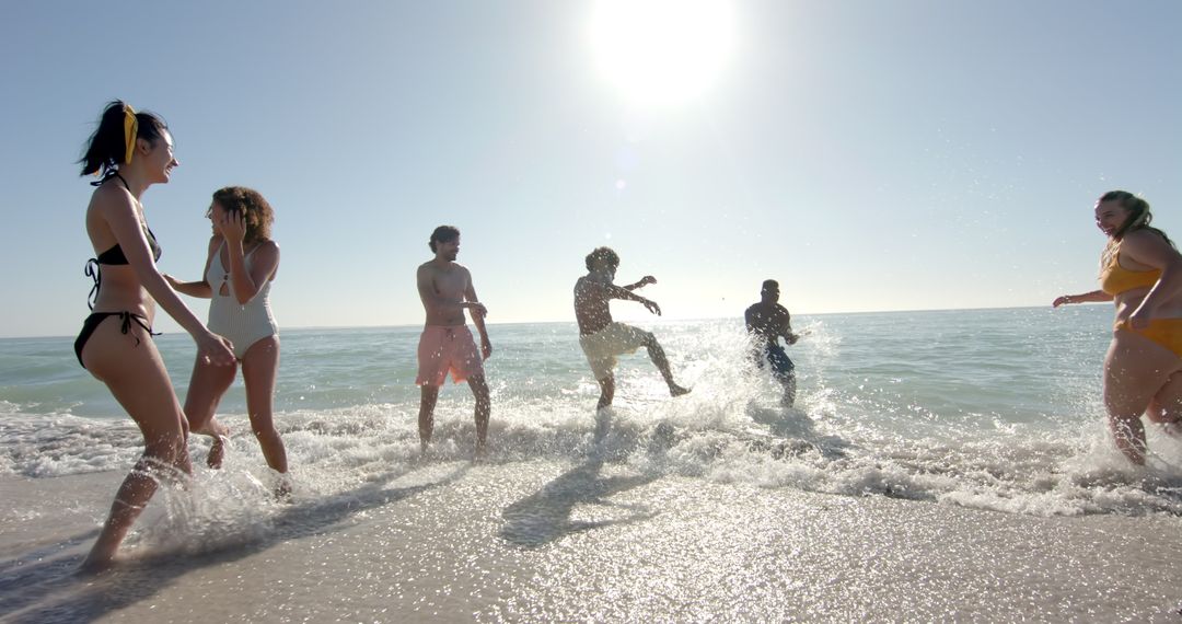 Group of Friends Enjoying Summer Beach Fun and Waves
