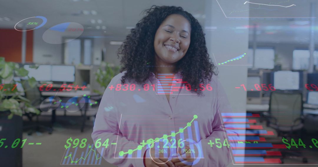 Smiling Businesswoman with Virtual Financial Graphics in Modern Office