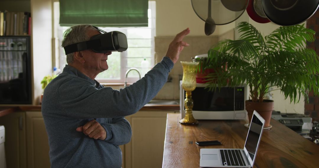 Senior Man using VR Headset for Virtual Reality Experience at Home - Free Images, Stock Photos and Pictures on Pikwizard.com